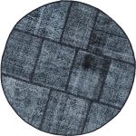 שטיח עגול בעיצוב טלאים שחור ולבן