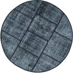 שטיח עגול שחור לבן מצמר בסגנון פאצ'וורק