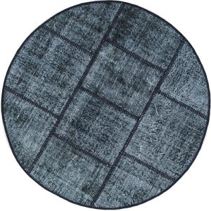 שטיח עגול שחור לבן מצמר בסגנון פאצ'וורק