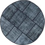 שטיח עגול גאומטרי בצבע שחור ולבן מצמר